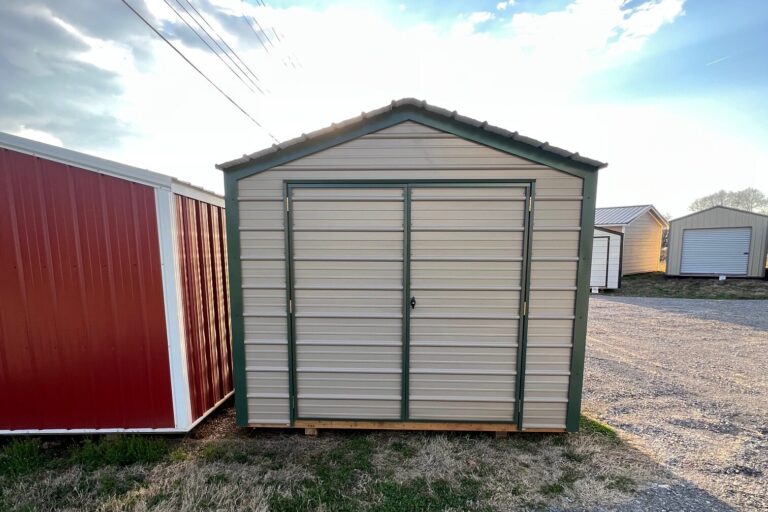 9x10 Economy Shed with tan metal siding and green trim featuring standard double doors