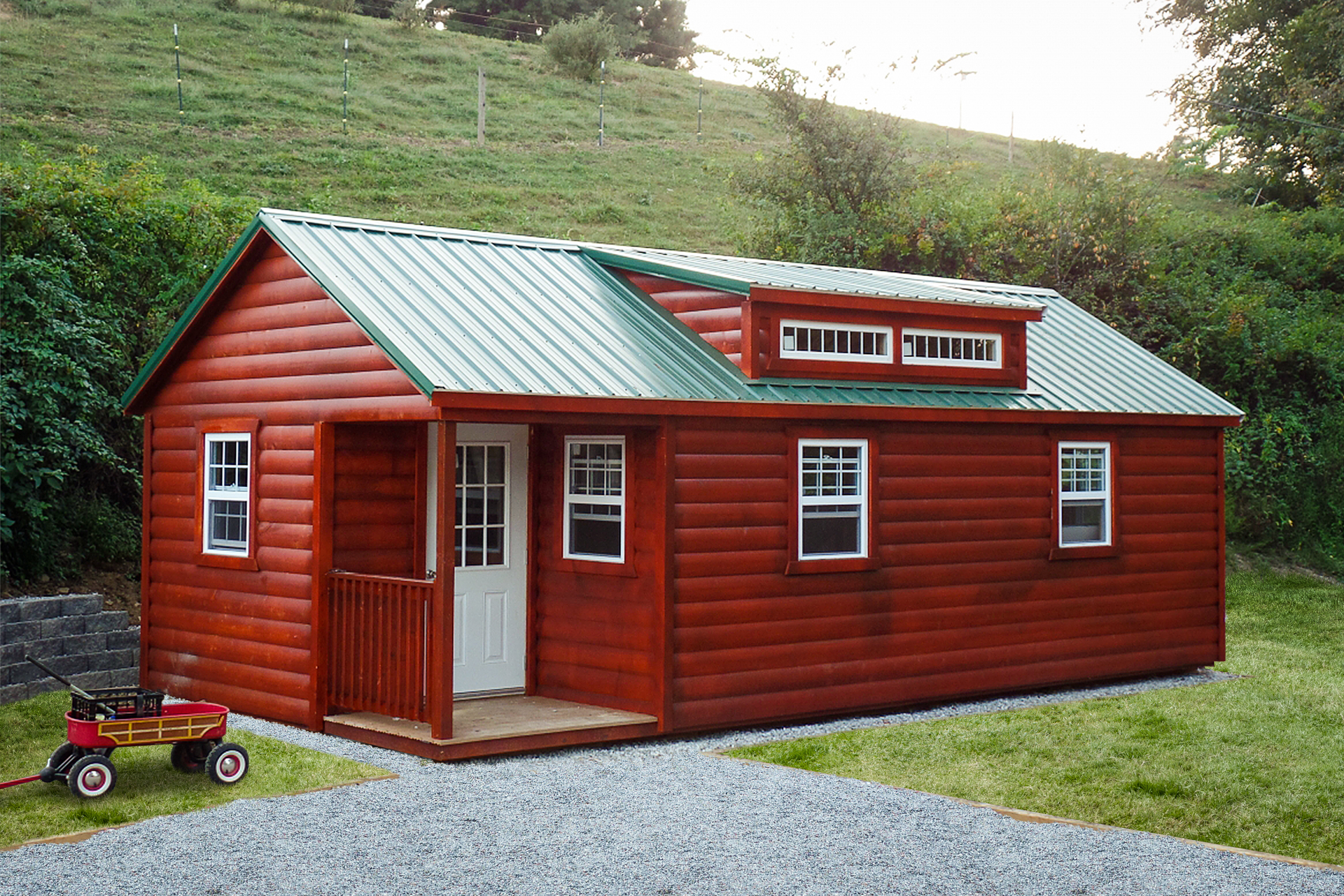 log cabin with a green metal roof and a porch in Nashville TN